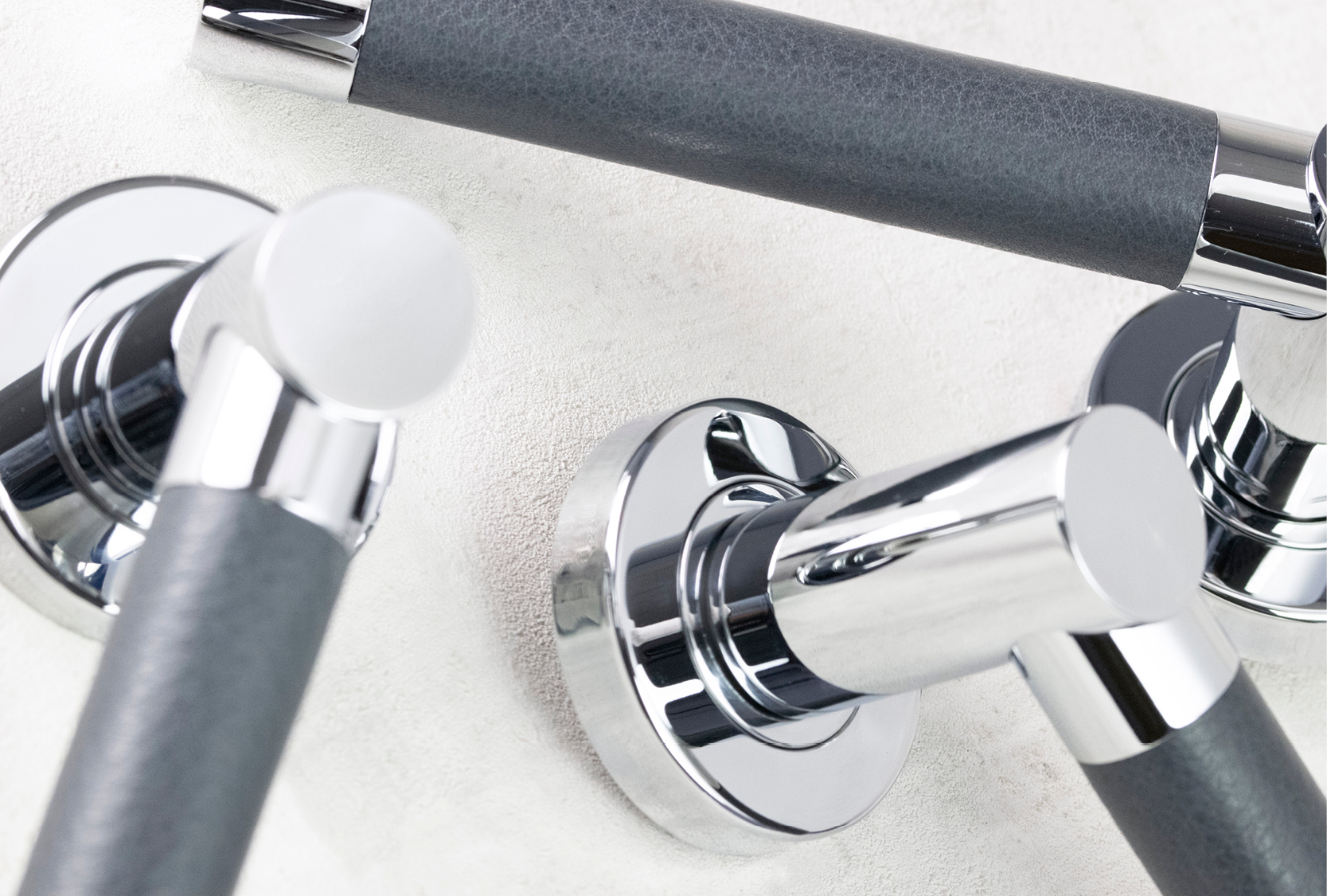 Custom barrel door lever with a custom grey leather. finished in bright chrome metal finish.