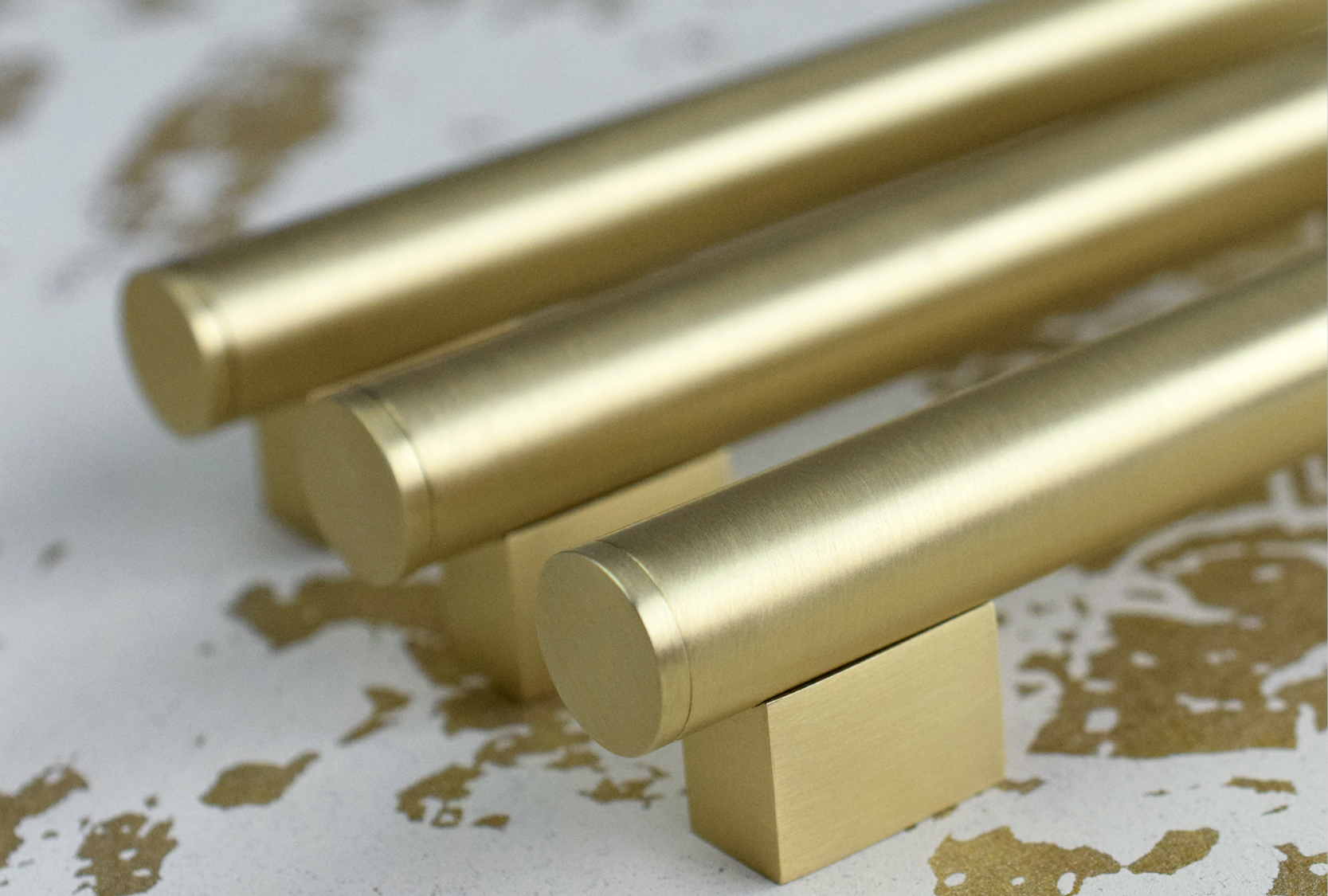 The image display, four coffin leg scroll cabinet pull. The cabinet pulls are finished in polished brass metal finish.