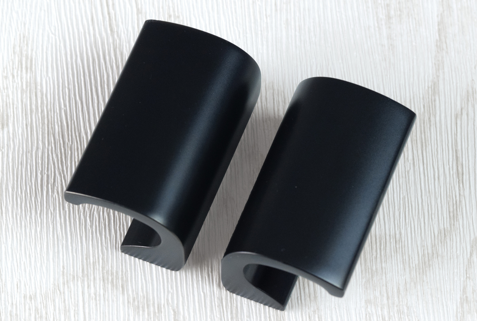 Image of two custom echo solid cabinet pull. As shown in matt black chrome metal finish