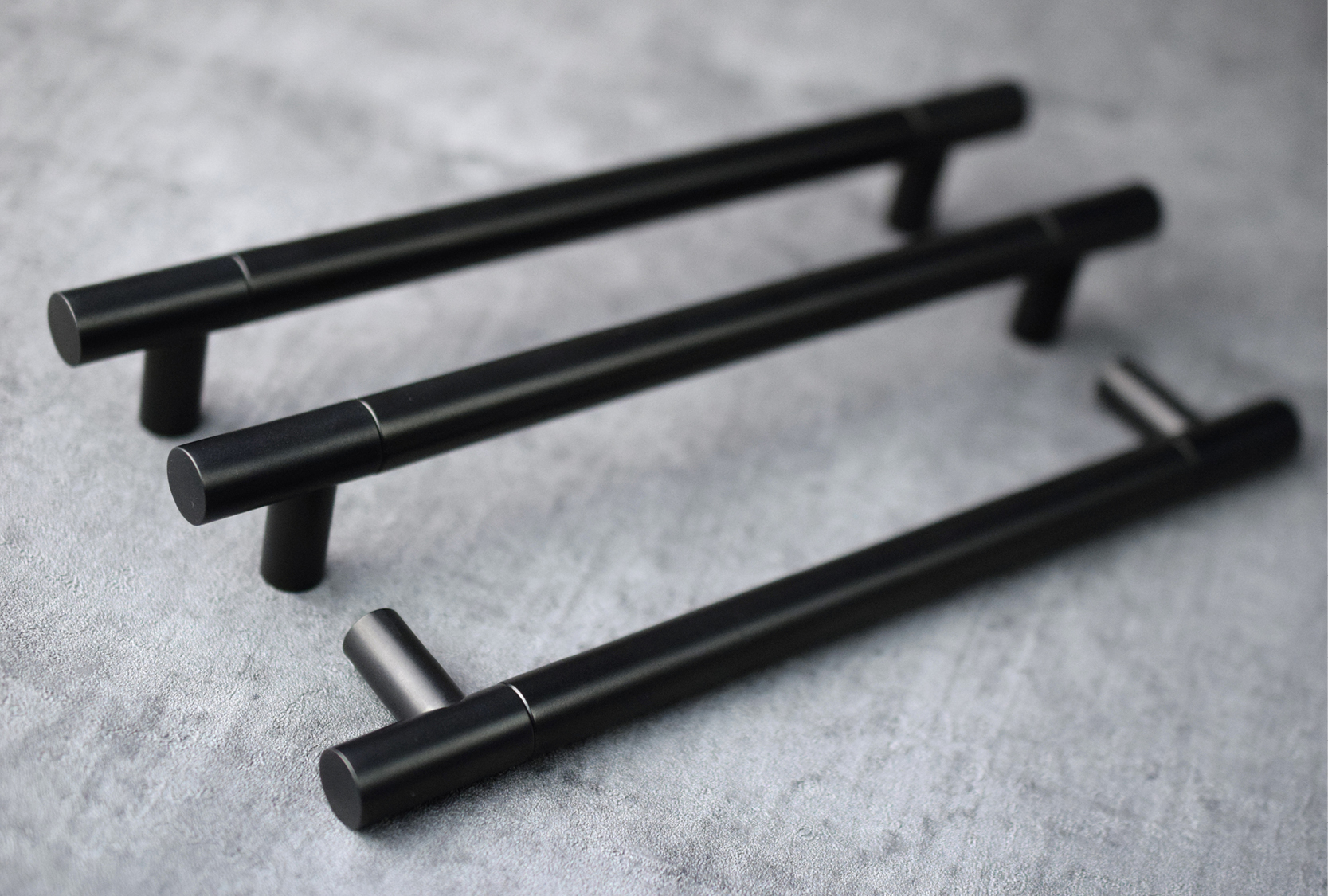 The Image is of a custom solid barrel pull handle. The luxury pull is handmade by Turnstyle Designs