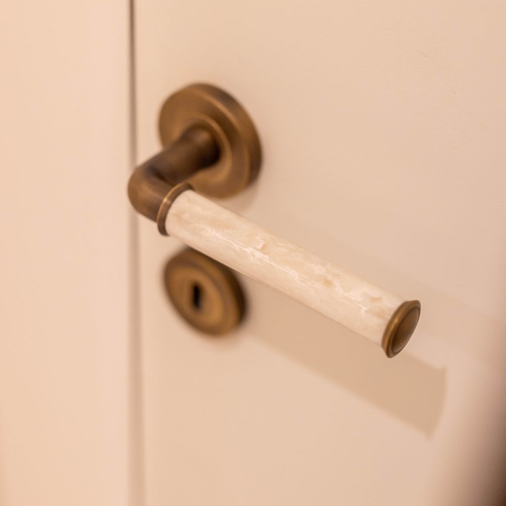 Turnstyle Designs Bonneville door lever design with custom grip.