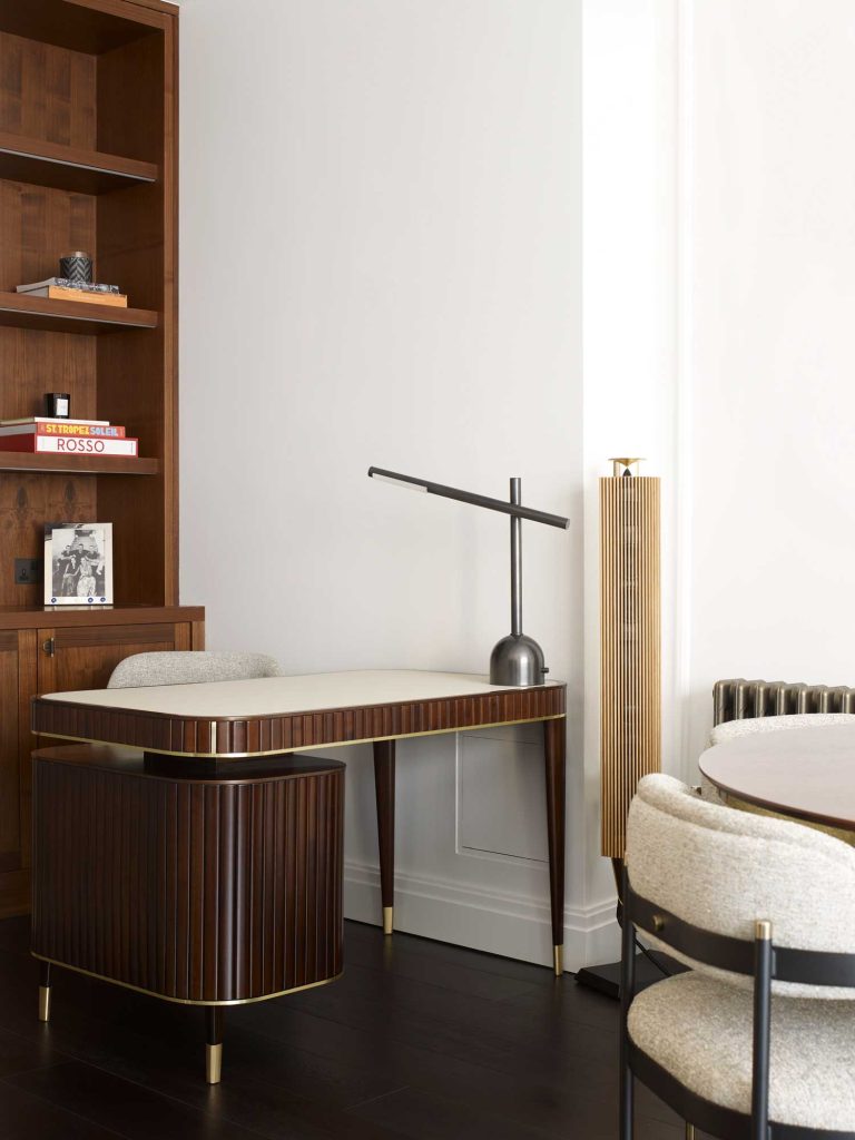 Decorative and unique custom joinery for this office space in a newly refurbished London apartment. Beautiful gold detailing on the desk and shelving unit.