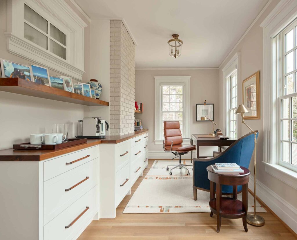 A light and bright office space with galley style room. Luxury hand stitched leather handles in Tan leather and a Vintage Nickel brass have been used on the large drawer units with deep walnut wooden counter tops. These handles are hand stitched by Turnstyle Designs.