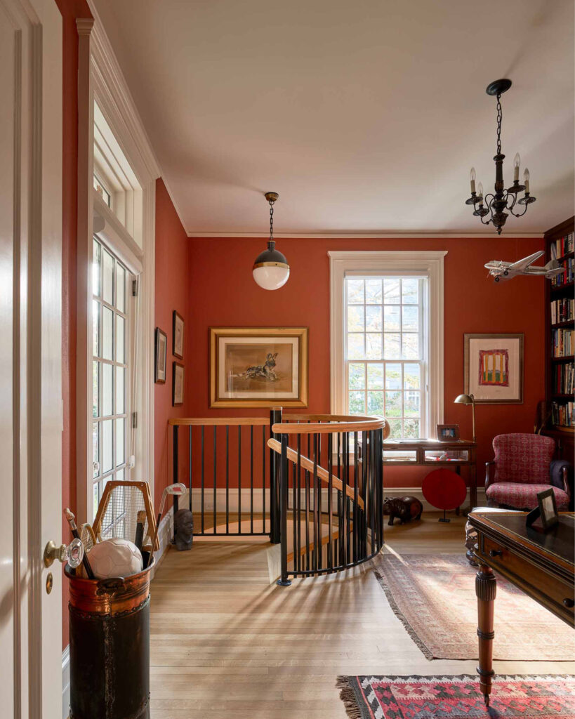 North Carolina residential project, this image shows the hallway to a large house with a staircase that descends to the first floor.