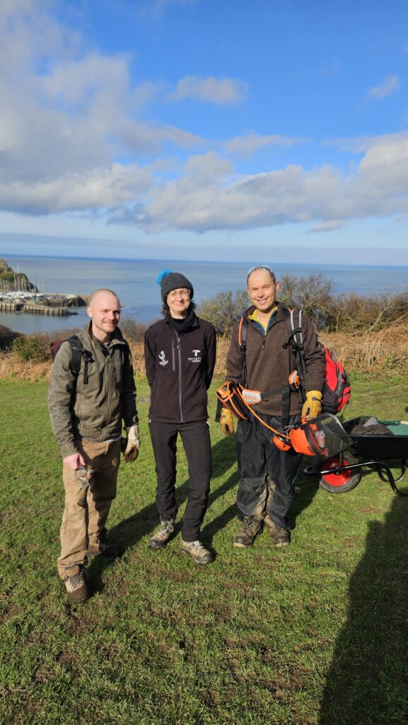 Two of team Turnstyle Designs standing with volunteer leader Bob from Friends of Hillsborough.